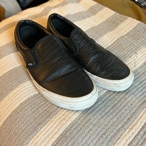 Vans size 9.5 black leather slip on sneakers.